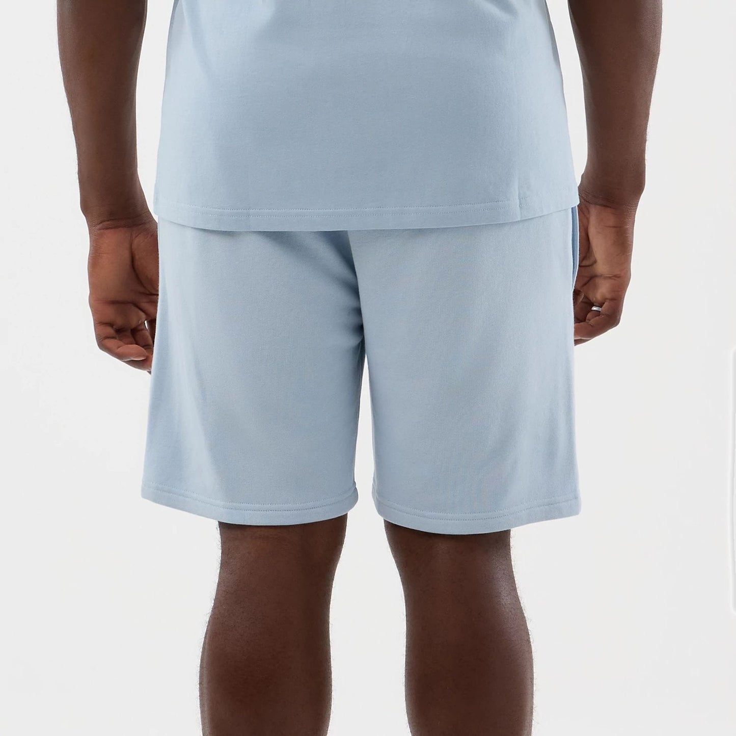 The model is wearing this NBA League Essential LA Lakers Shorts in pastel blue. 5