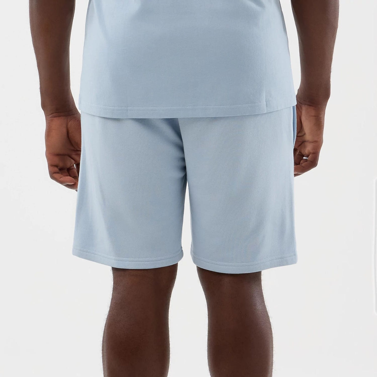 The model is wearing this NBA League Essential LA Lakers Shorts in pastel blue. 5