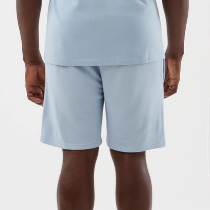 The model is wearing this NBA League Essential LA Lakers Shorts in pastel blue. 5
