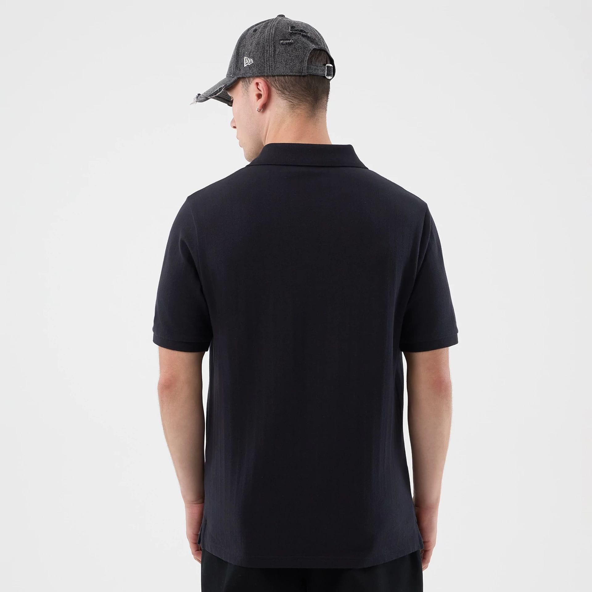 The model is wearing this MLB Rib New York Yankees Polo T-Shirt in navy. 2