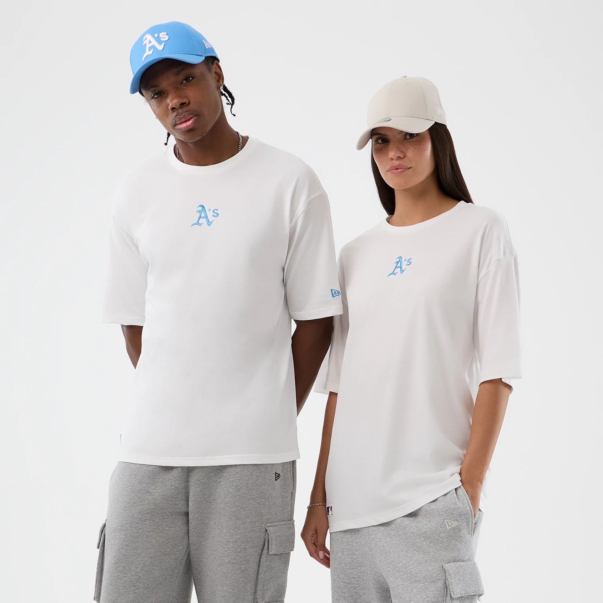 The model is wearing this MLB League Essential Athletics Oversized T-Shirt in white. 1