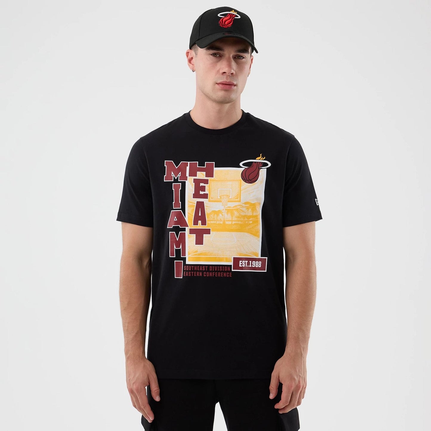 The model is wearing this NBA Graphic Miami Heat T-Shirt in black. 1