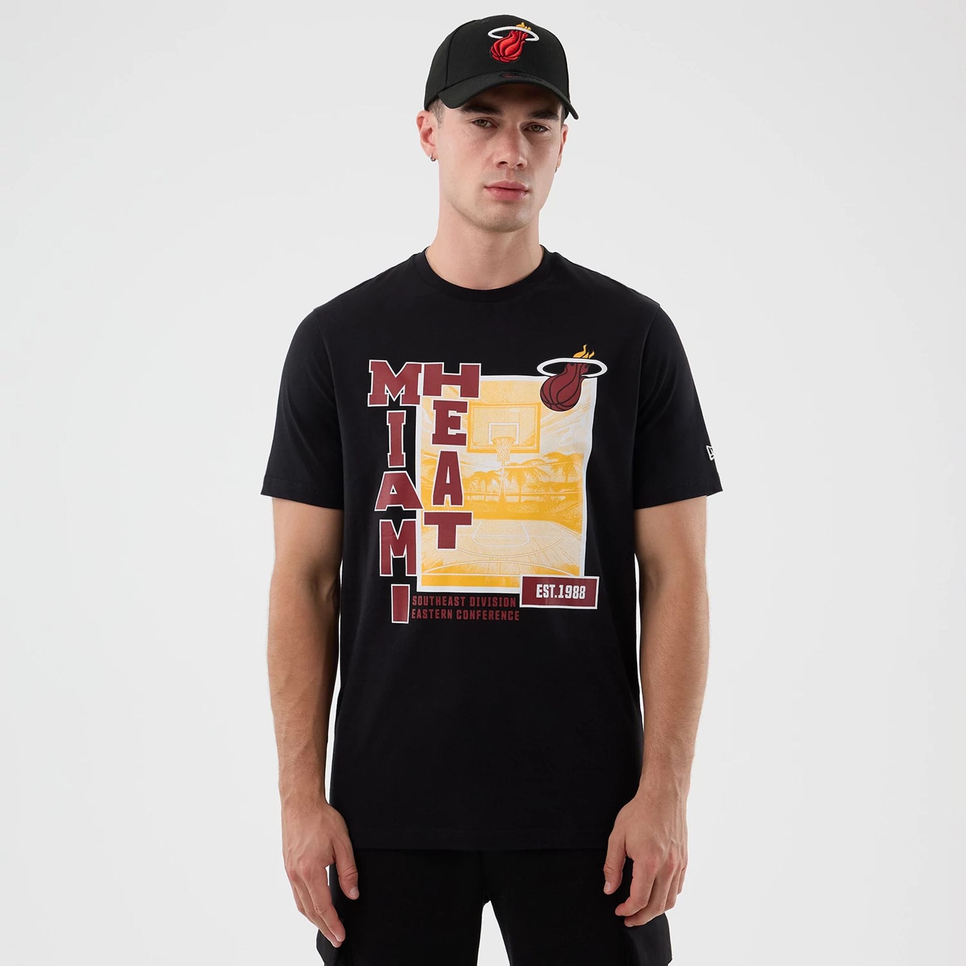 The model is wearing this NBA Graphic Miami Heat T-Shirt in black. 1