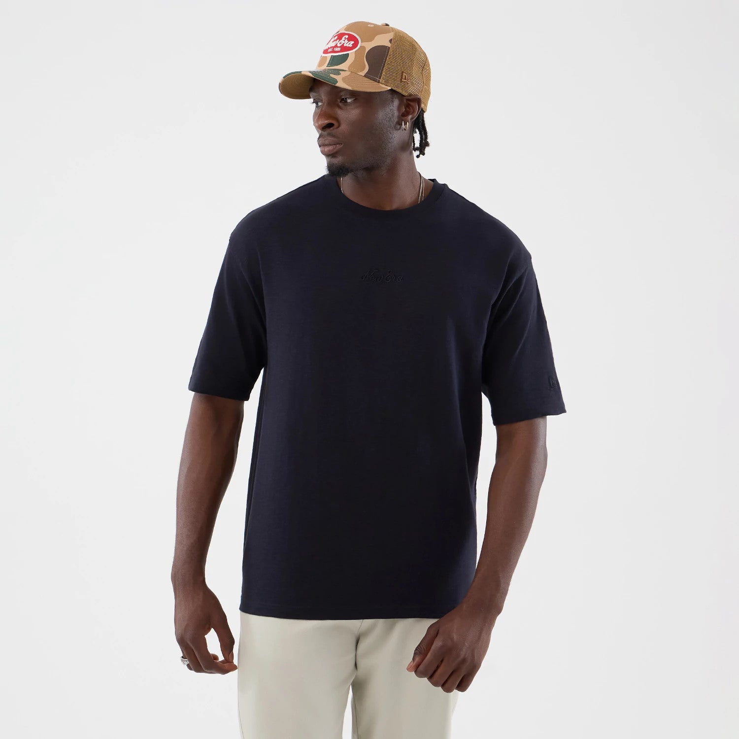 The model is wearing this New Era Slub Oversized T-Shirt in navy. 3