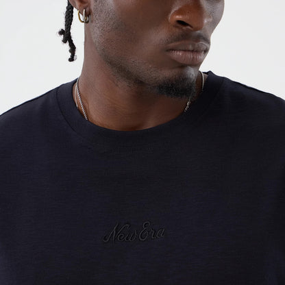The model is wearing this New Era Slub Oversized T-Shirt in navy. 4
