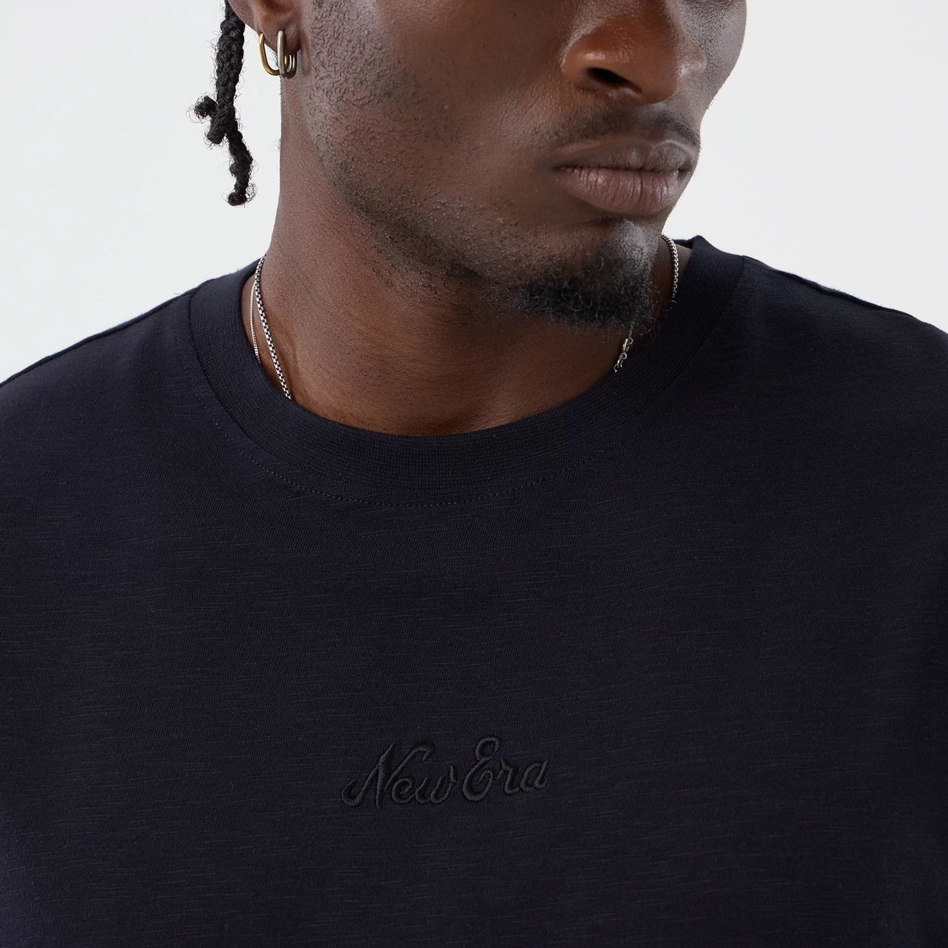 The model is wearing this New Era Slub Oversized T-Shirt in navy. 4