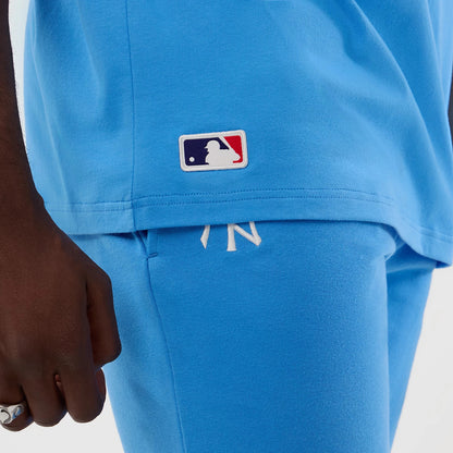 The model is wearing this MLB League Essential New York Yankees Oversized T-Shirt in pastel blue. 6