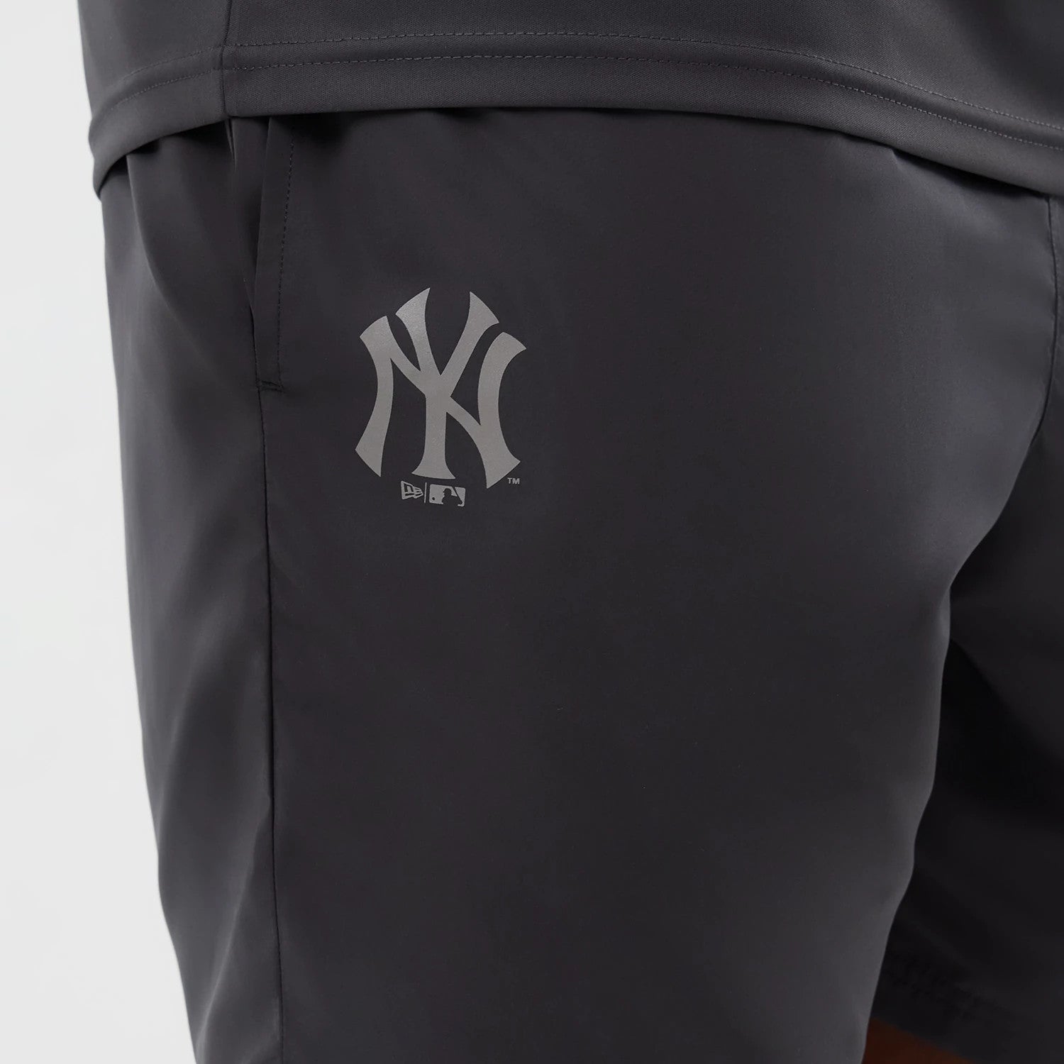 The model is wearing this MLB Core Plus New York Yankees Shorts in dark grey. 3