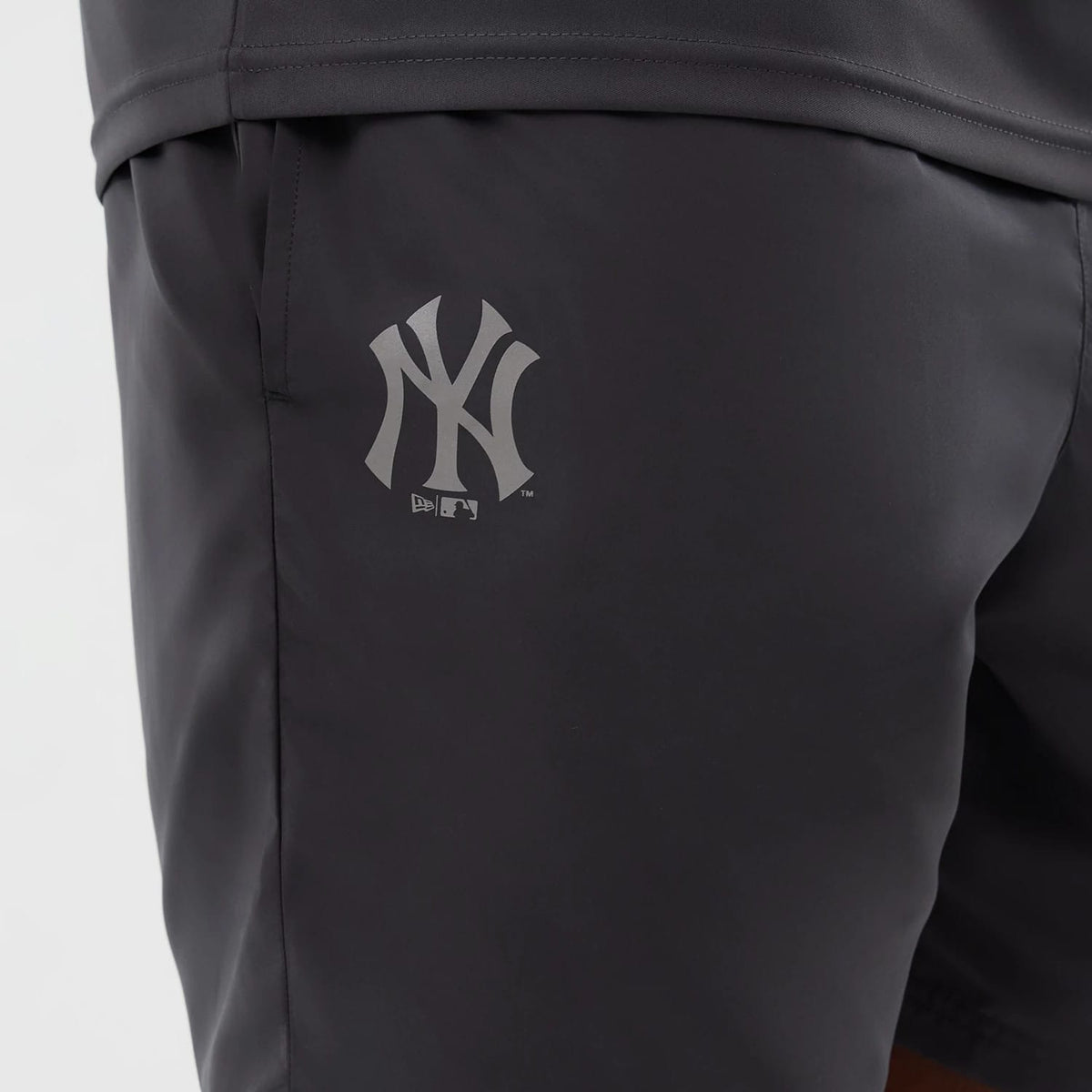 The model is wearing this MLB Core Plus New York Yankees Shorts in dark grey. 3