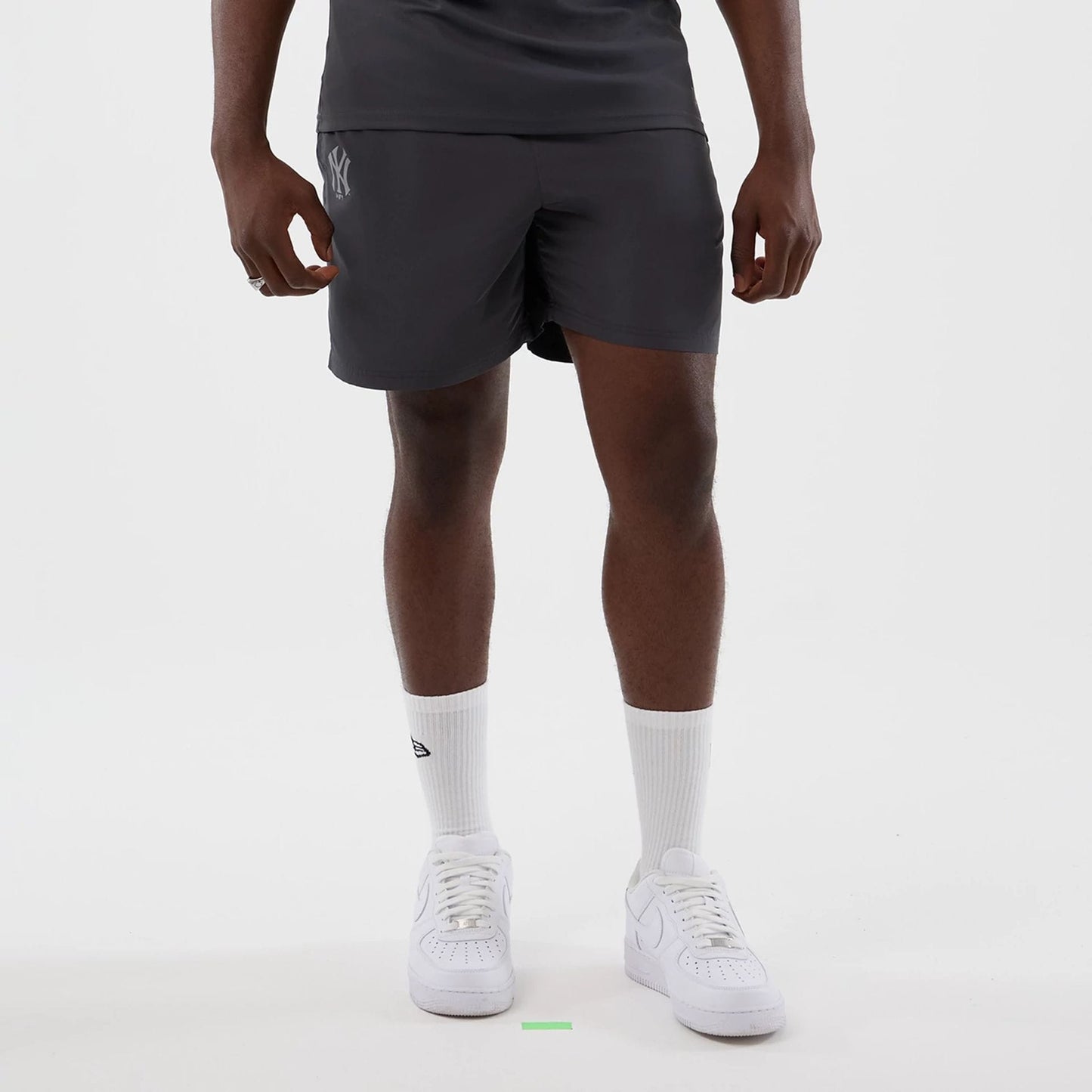 The model is wearing this MLB Core Plus New York Yankees Shorts in dark grey. 1