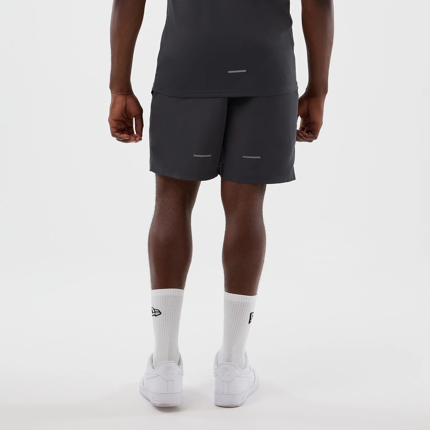 The model is wearing this MLB Core Plus New York Yankees Shorts in dark grey. 2