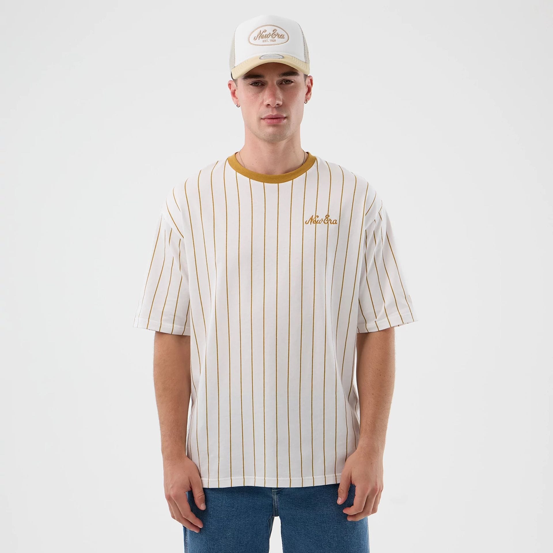 The model is wearing this New Era Pinstripe Oversized T-Shirt in white. 1
