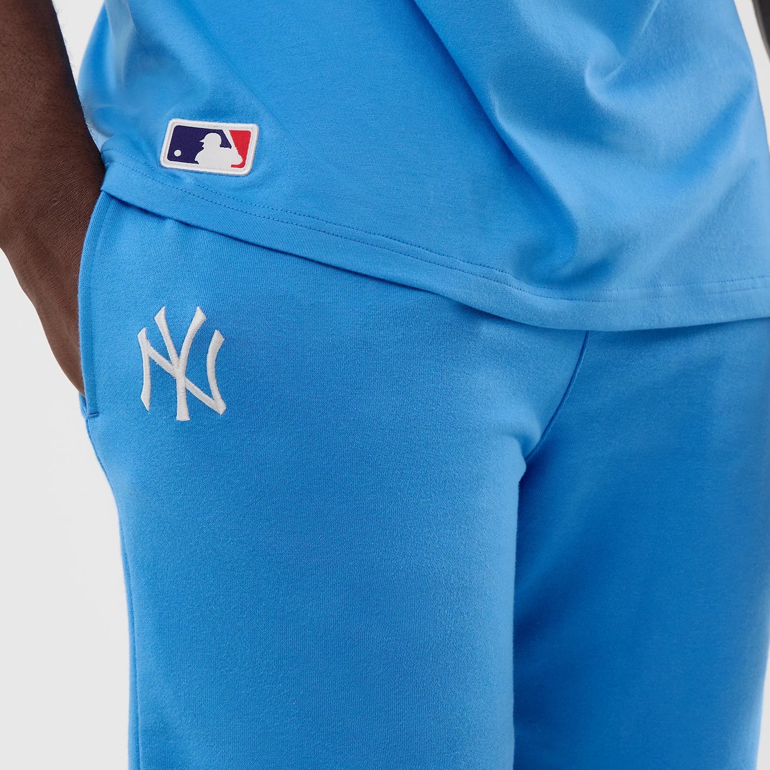 The model is wearing this MLB League Essential New York Yankees Shorts in pastel blue. 4