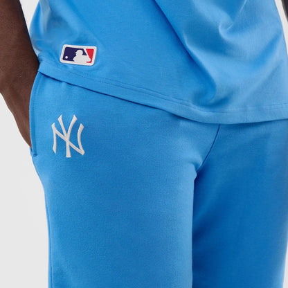 The model is wearing this MLB League Essential New York Yankees Shorts in pastel blue. 4
