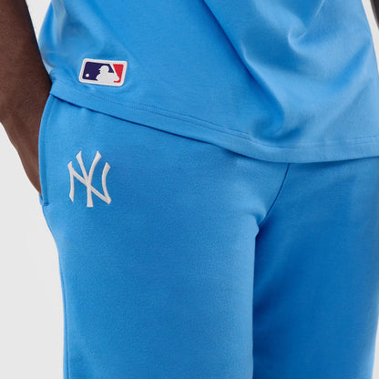 The model is wearing this MLB League Essential New York Yankees Shorts in pastel blue. 4