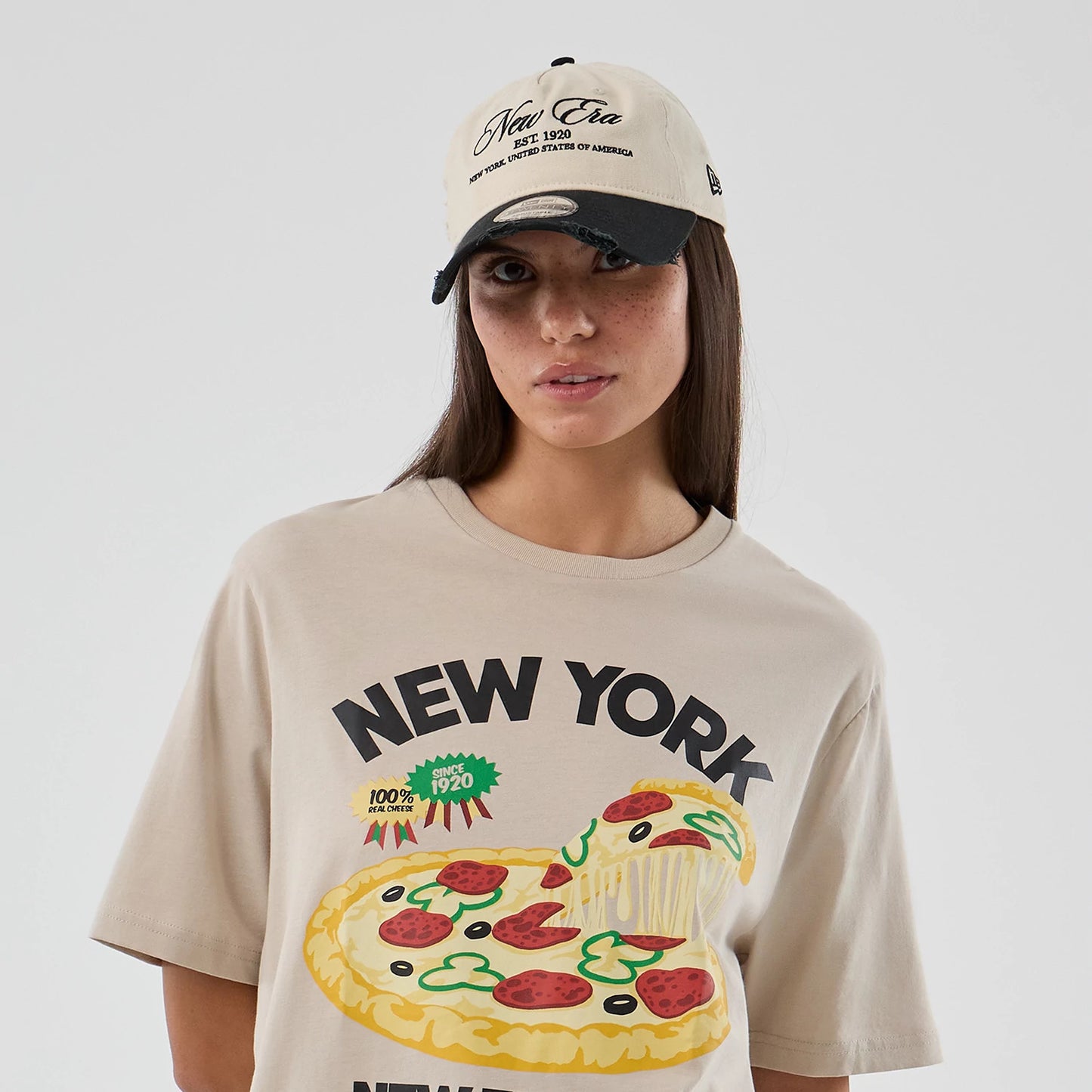 The model is wearing this New Era Pizza Graphic T-Shirt in light beige. 6
