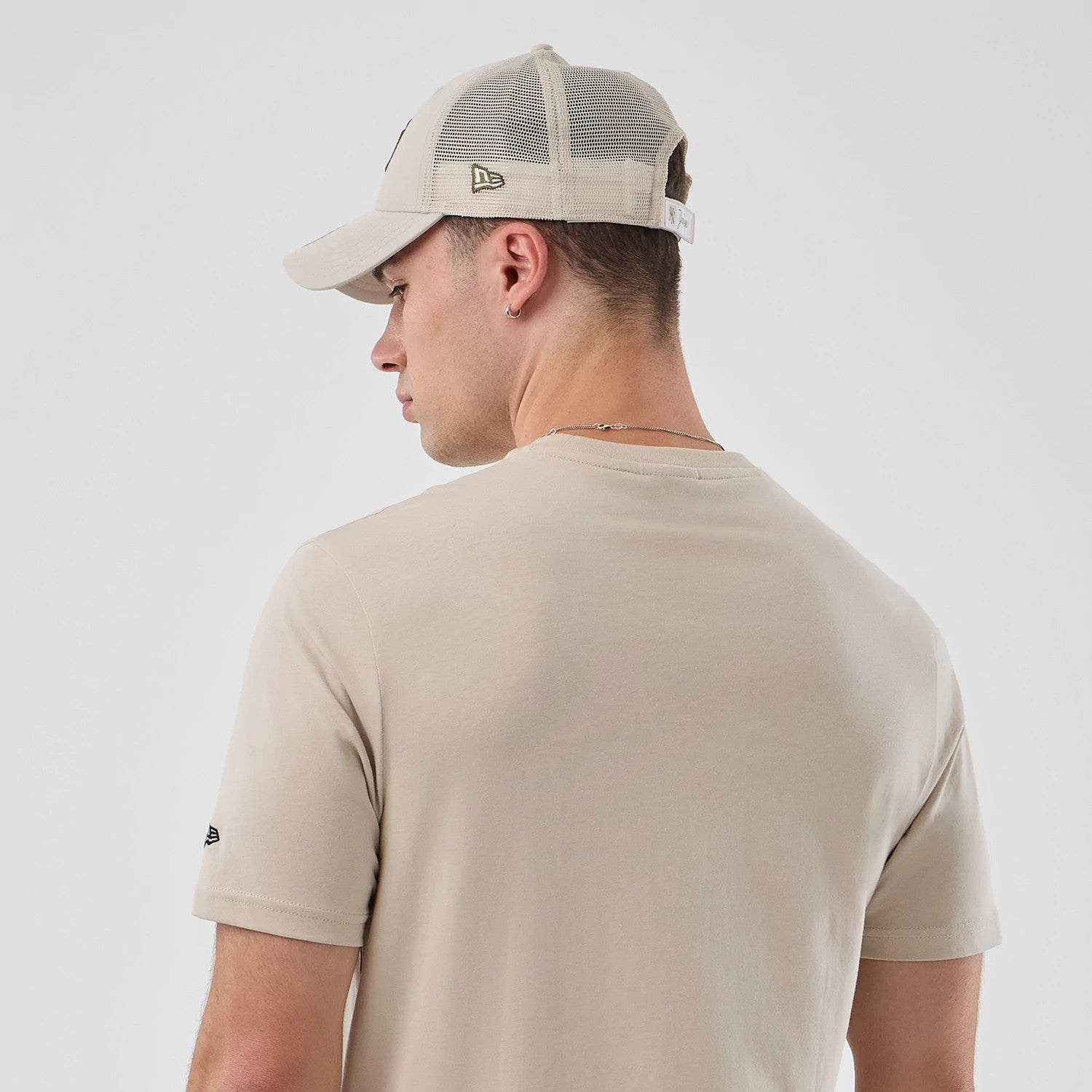 The model is wearing this New Era Pizza Graphic T-Shirt in light beige. 8