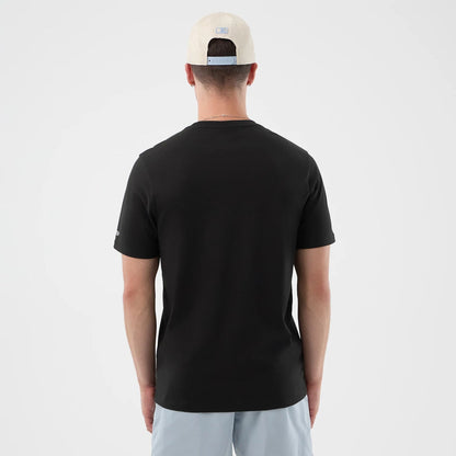 The model is wearing this New Era Logo Graphic T-Shirt in black. 2