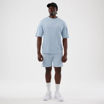 The model is wearing this NBA League Essential LA Lakers Oversized T-Shirt in pastel blue. 8