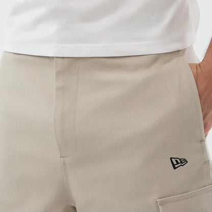 The model is wearing this New Era Cargo Shorts in light beige. 4