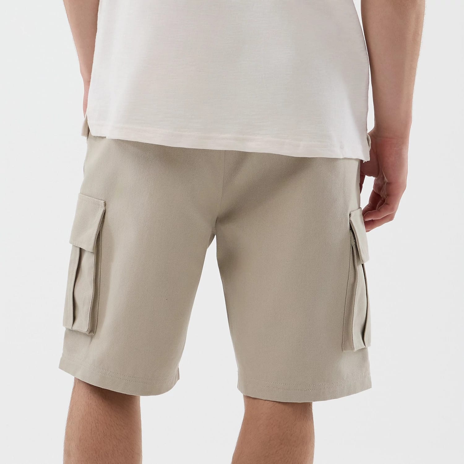 The model is wearing this New Era Cargo Shorts in light beige. 6