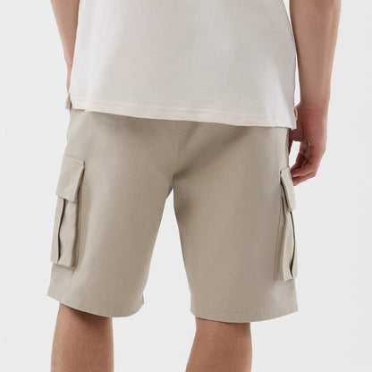 The model is wearing this New Era Cargo Shorts in light beige. 6