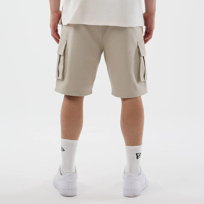 The model is wearing this New Era Cargo Shorts in light beige. 7