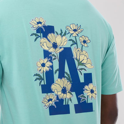 The model is wearing this MLB Floral LA Dodgers Oversized T-Shirt in pastel green. 4