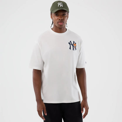 The model is wearing this MLB Floral New York Yankees Oversized T-Shirt in white. 3