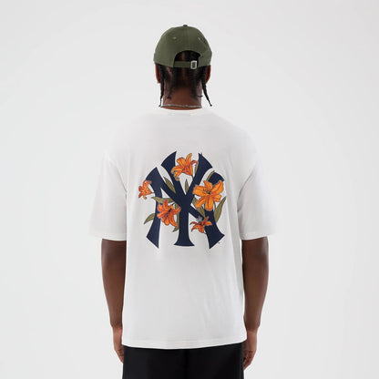 The model is wearing this MLB Floral New York Yankees Oversized T-Shirt in white. 2