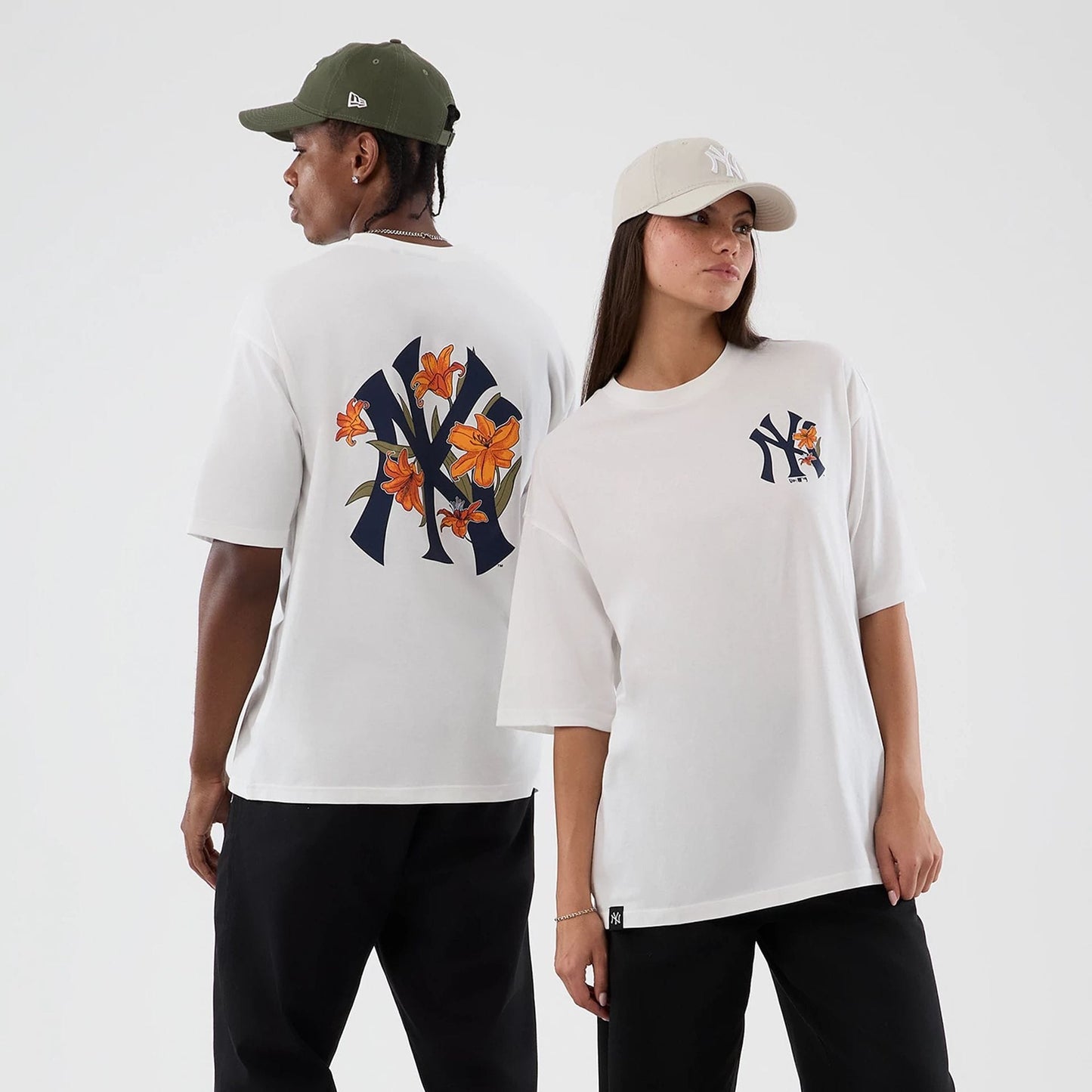 The model is wearing this MLB Floral New York Yankees Oversized T-Shirt in white. 1