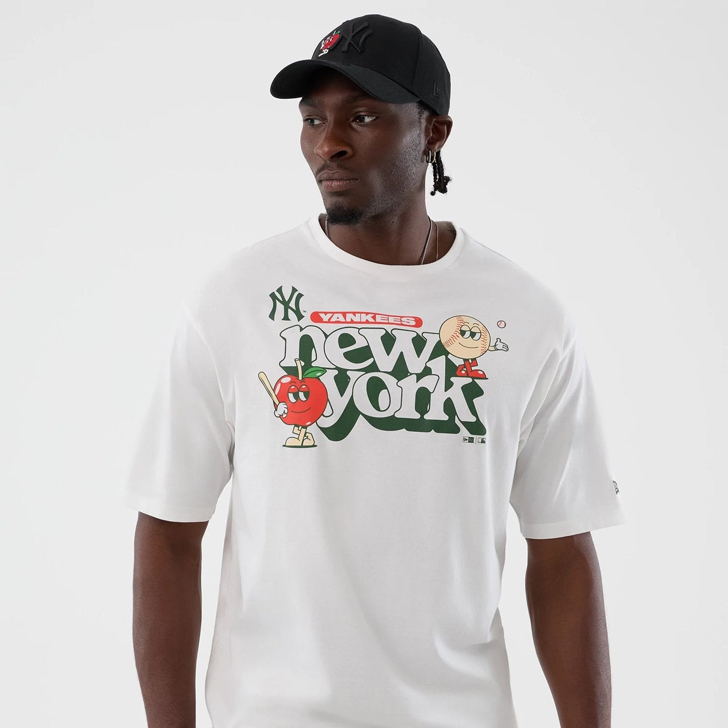 The model is wearing this MLB Icon Graphic New York Yankees T-Shirt in white. 3