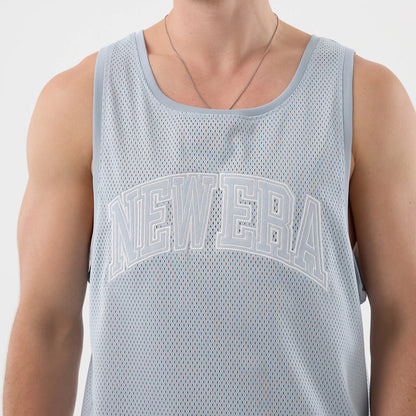 The model is wearing this New Era Mesh Oversized Tank Top in pastel blue. 3