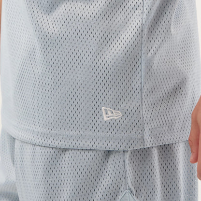 The model is wearing this New Era Mesh Oversized Tank Top in pastel blue. 7