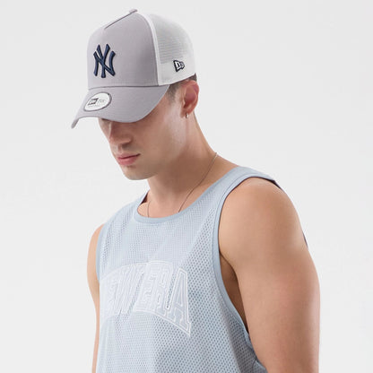 The model is wearing this New Era Mesh Oversized Tank Top in pastel blue. 4