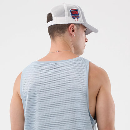 The model is wearing this New Era Mesh Oversized Tank Top in pastel blue. 5