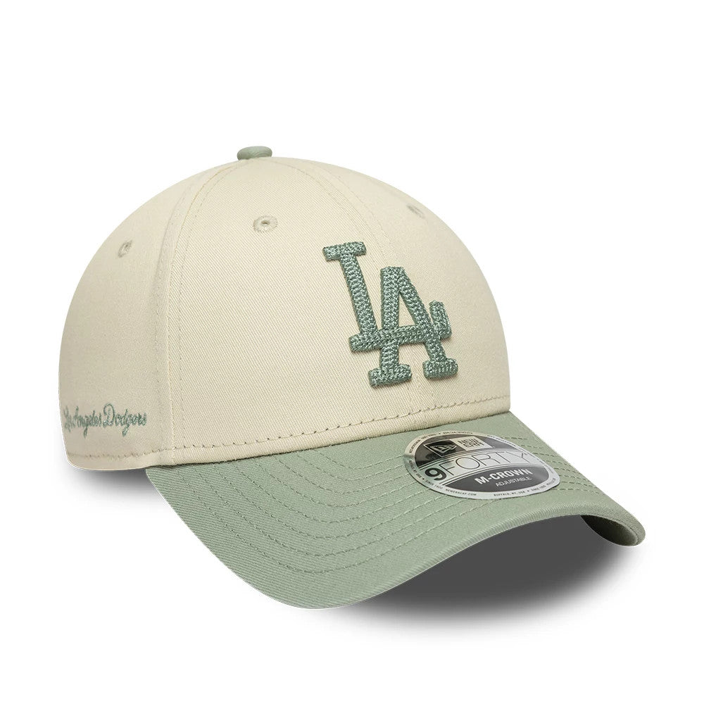 Pictured is this MLB Side Script LA Dodgers 9FORTY M-Crown cap in Cream. 1