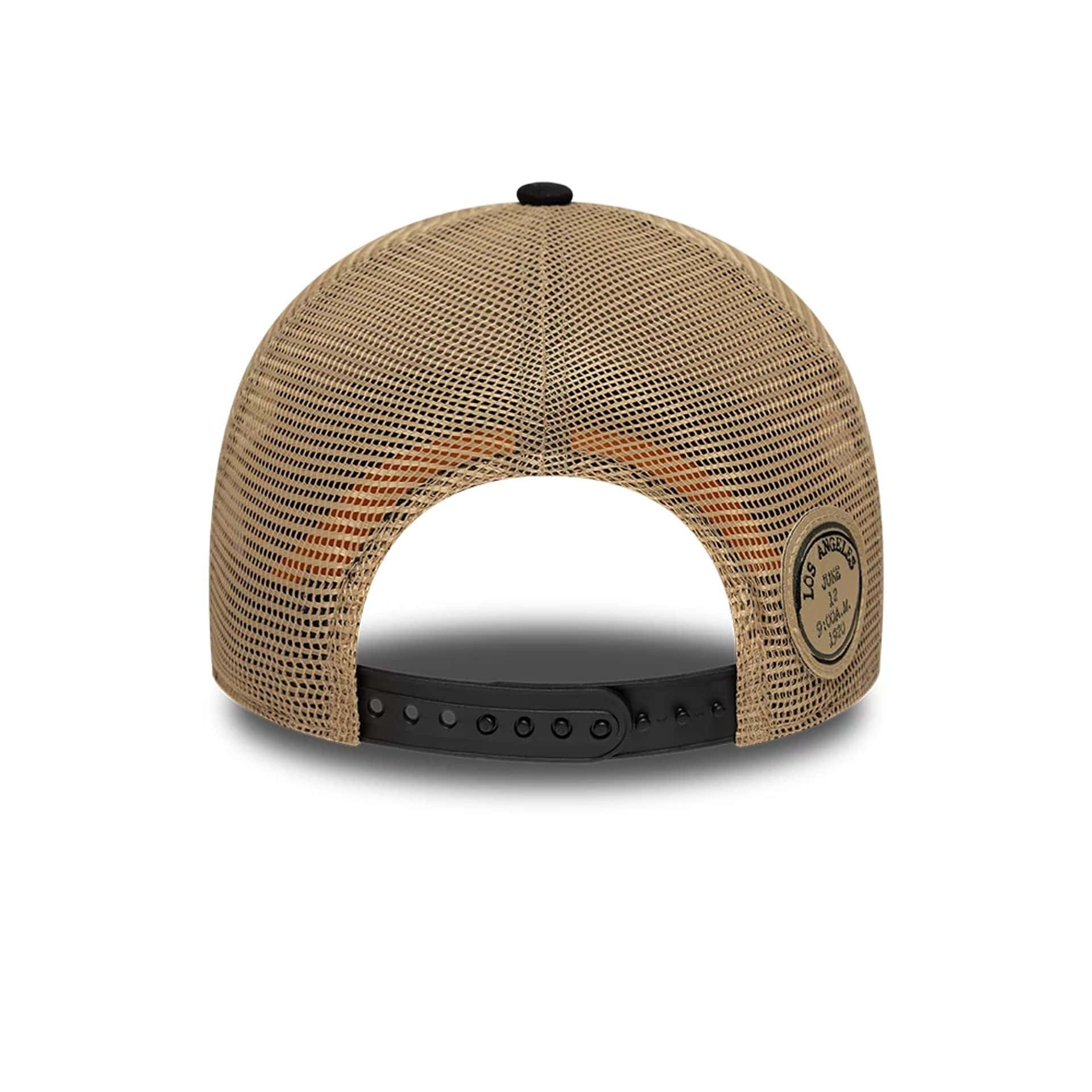 Pictured is this Youth New Era Location 9FORTY A-Frame Trucker cap in light beige. 4