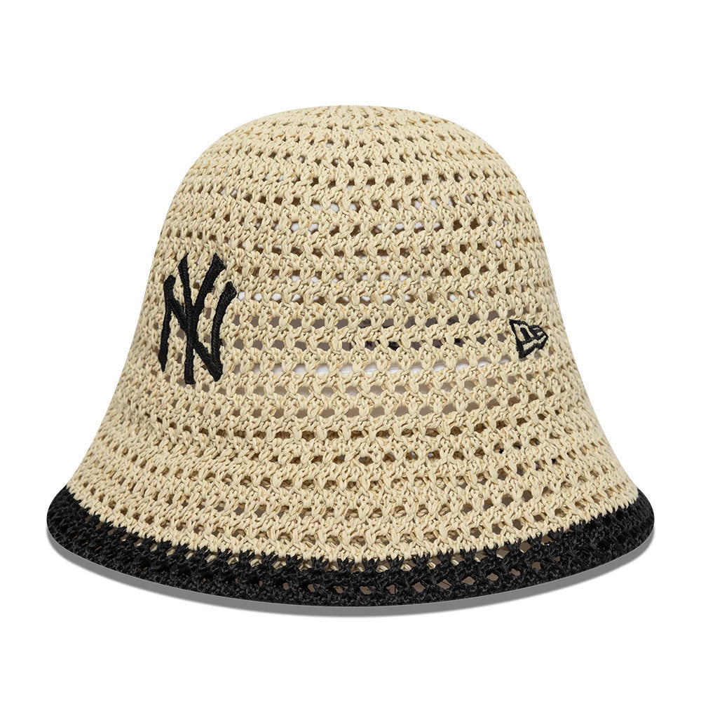 New Era New York Yankees Womens MLB Knitted Light Beige Explorer Bucket Hat, front view showing the black embroidered NY logo on a light beige open-knit crown, with the New Era flag logo on the side and a contrasting black edge on the visor.