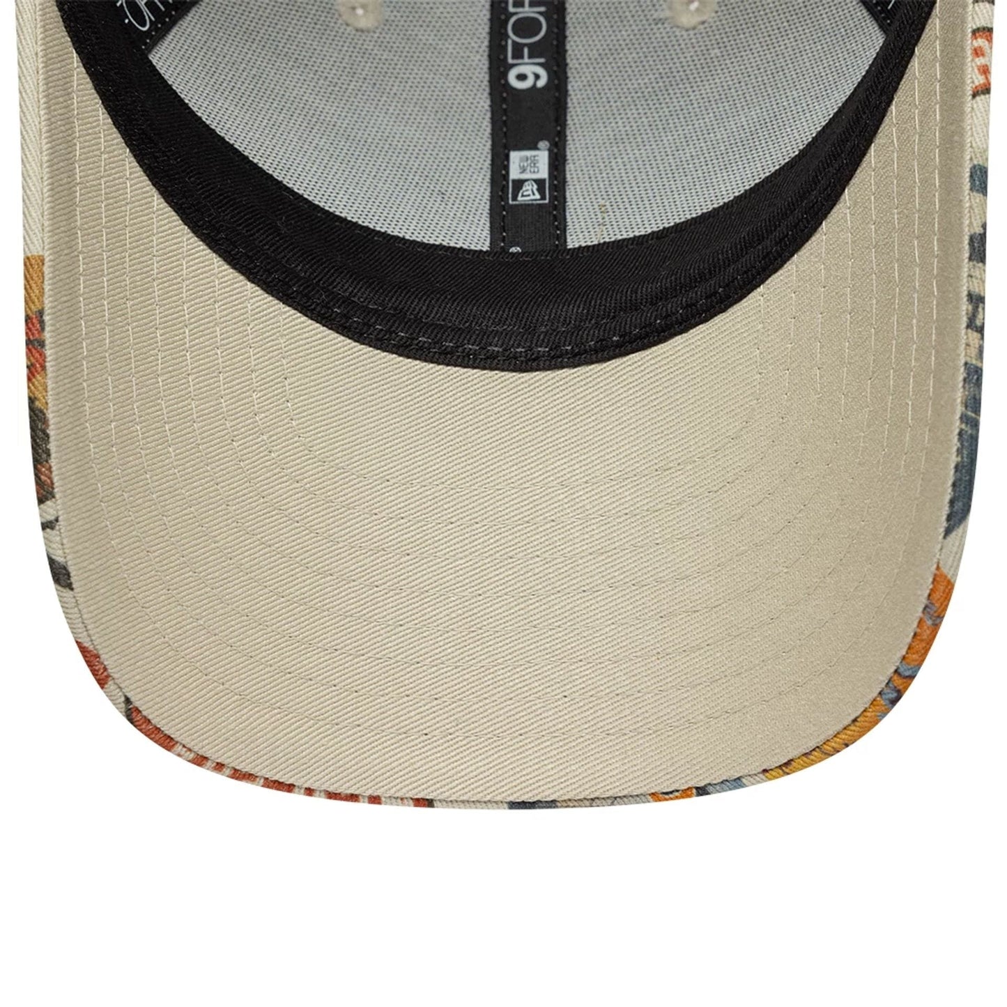 Pictured is this Youth New Era Location 9FORTY cap in light beige. 5