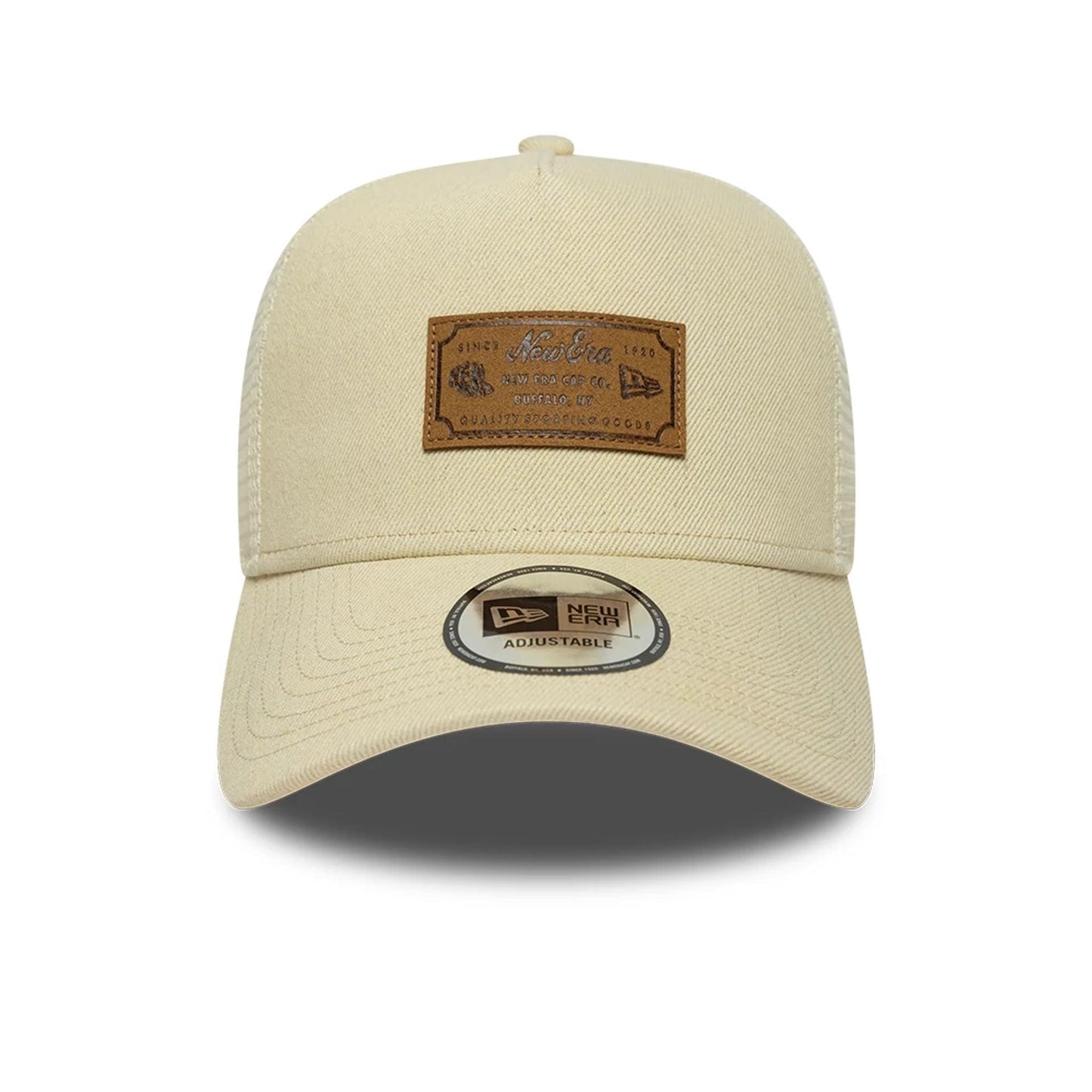 Pictured is this New Era Leather Patch 9FORTY A-Frame Trucker cap in light beige. 2
