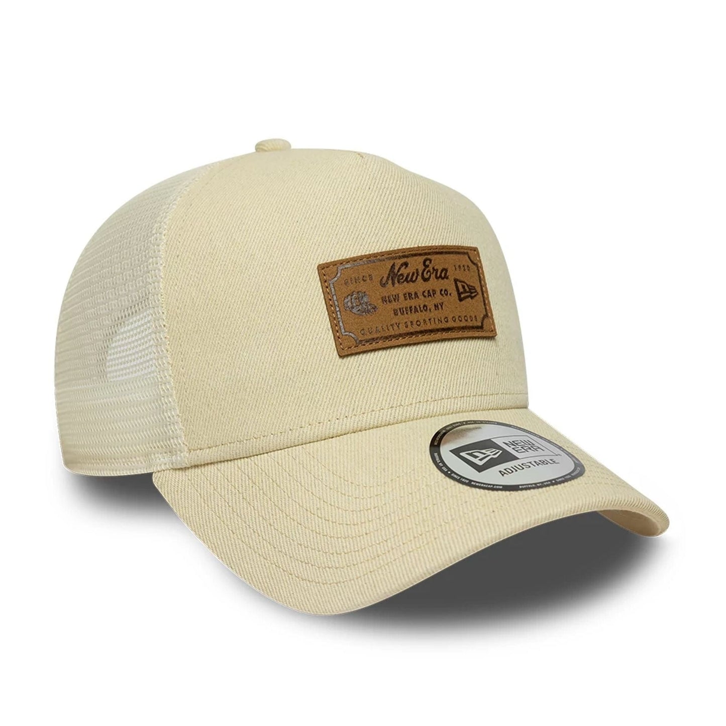 Pictured is this New Era Leather Patch 9FORTY A-Frame Trucker cap in light beige. 3