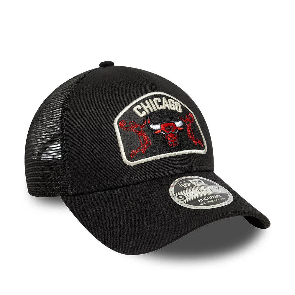 Chicago Bulls NBA Black New Era 9FORTY M-Crown A-Frame Trucker Adjustable Cap, three-quarter view showing the raised red and white Bulls logo on the black front panel, curved black visor with a 9FORTY size sticker, and mesh rear panels.
