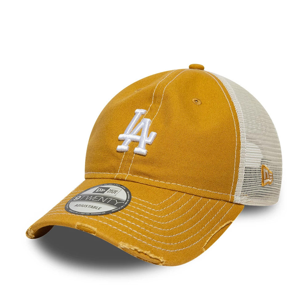 LA Dodgers MLB Cotton Canvas Beige New Era 9TWENTY Trucker Adjustable Cap, three-quarter view showing the white raised LA logo on the front panel, a curved visor with a 9TWENTY size sticker, and mesh rear panels with an embroidered New Era flag logo.