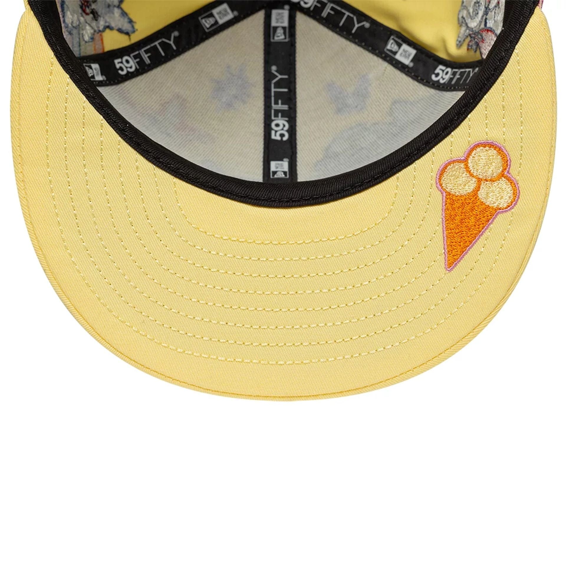 Pictured is this Kenzo X New Era 59FIFTY Fitted cap in pastel yellow. 2