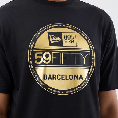 The model is wearing this New Era Sticker Barcelona Oversized T-Shirt in black. 5