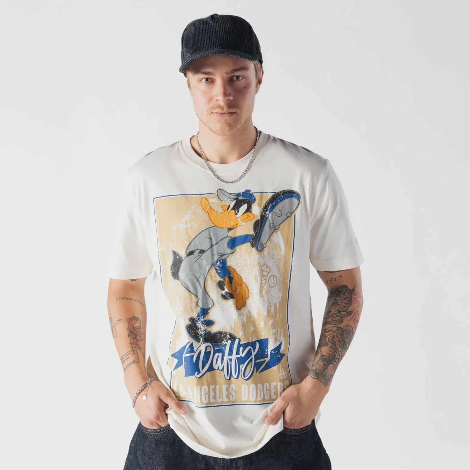 The model is wearing this MLB X Looney Tunes LA Dodgers T-Shirt in Cream. 1