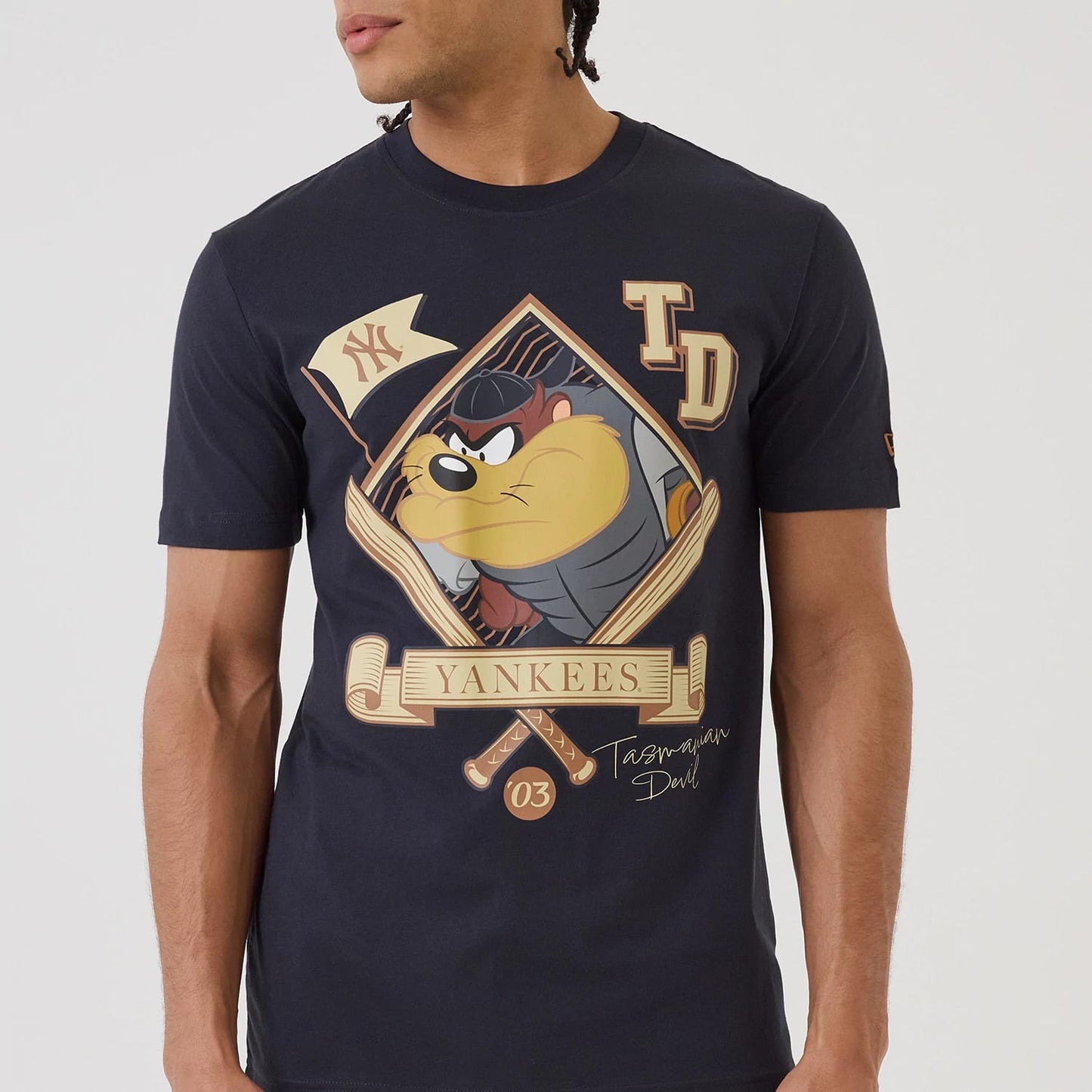 The model is wearing this MLB X Looney Tunes New York Yankees T-Shirt in navy. 4