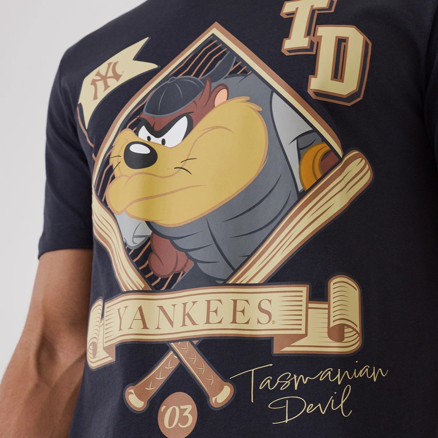 The model is wearing this MLB X Looney Tunes New York Yankees T-Shirt in navy. 3