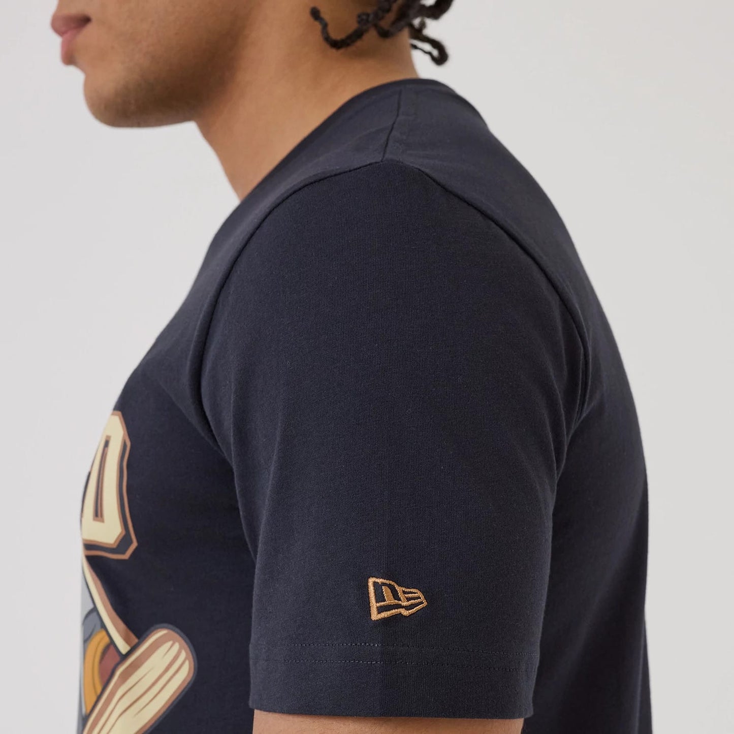 The model is wearing this MLB X Looney Tunes New York Yankees T-Shirt in navy. 5